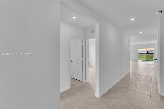 1130 SW Jericho Ave, Port St Lucie, FL 34953 - hallway featuring light tile patterned flooring and recessed lighting