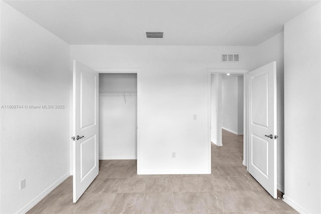 1130 SW Jericho Ave, Port St Lucie, FL 34953 - unfurnished bedroom with a closet and baseboards
