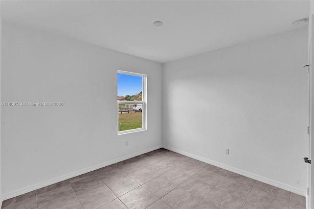 1130 SW Jericho Ave, Port St Lucie, FL 34953 - spare room featuring a smoke detector and light tile patterned floors