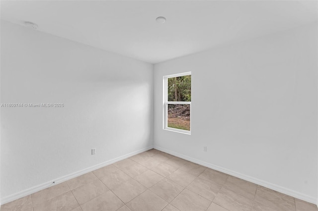 1130 SW Jericho Ave, Port St Lucie, FL 34953 - empty room featuring a smoke detector and baseboards