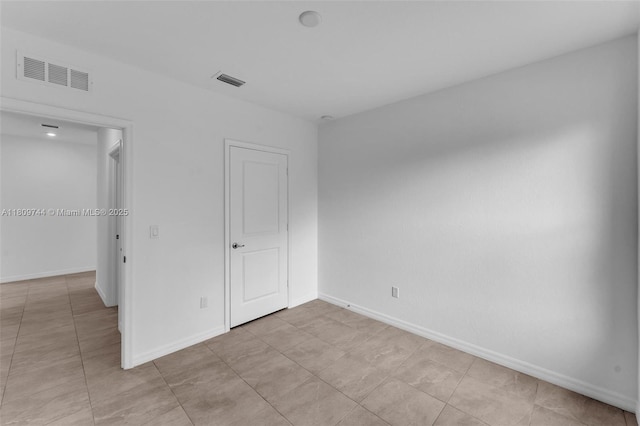 1130 SW Jericho Ave, Port St Lucie, FL 34953 - unfurnished bedroom featuring baseboards and light tile patterned floors