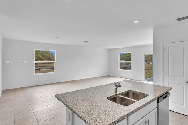 1130 SW Jericho Ave, Port St Lucie, FL 34953 - kitchen with dishwasher, open floor plan, plenty of natural light, light stone counters, and recessed lighting