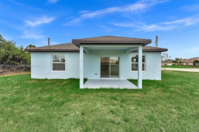 1130 SW Jericho Ave, Port St Lucie, FL 34953 - rear view of property featuring a patio, stucco siding, a yard, and roof with shingles