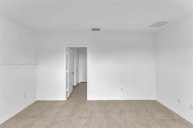 1130 SW Jericho Ave, Port St Lucie, FL 34953 - spare room with baseboards and light tile patterned flooring