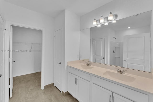 1130 SW Jericho Ave, Port St Lucie, FL 34953 - full bathroom featuring double vanity and a walk in closet