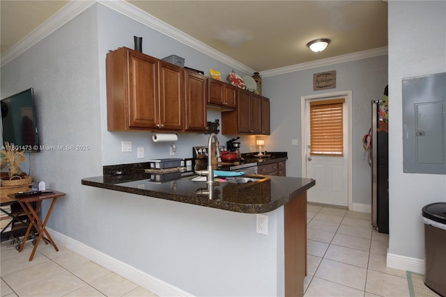16610 SW 294th Ter, Homestead, FL 33033 - kitchen featuring a sink, electric panel, a peninsula, light tile patterned floors, and crown molding