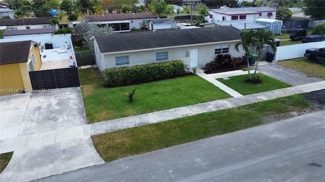 16610 SW 294th Ter, Homestead, FL 33033 - view of front of property featuring driveway, stucco siding, and a gate