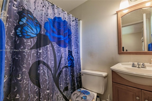 5156 NE 6th Ave Unit 227, Oakland Park, FL 33334 - bathroom with vanity, toilet, and curtained shower