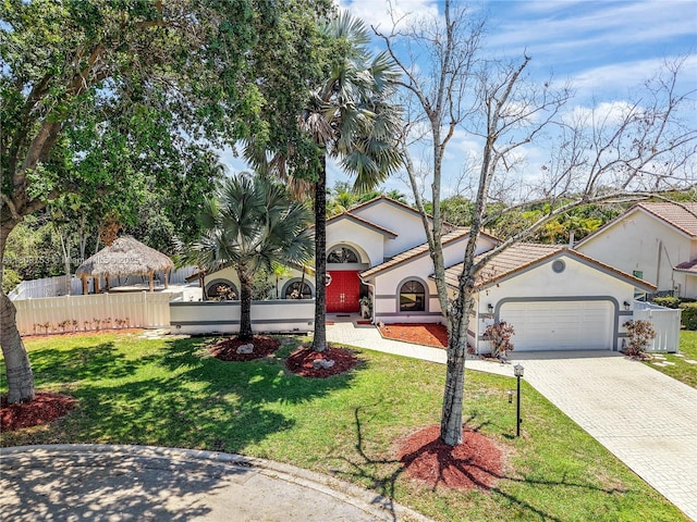 10412 NW 6th St, Coral Springs, FL 33071 - view of front facade featuring stucco siding, decorative driveway, an attached garage, and a gazebo