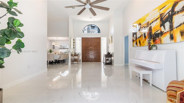 10412 NW 6th St, Coral Springs, FL 33071 - entryway featuring a high ceiling, marble finish floors, baseboards, and ceiling fan