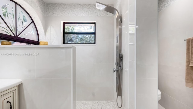 10412 NW 6th St, Coral Springs, FL 33071 - bathroom featuring tile walls, a walk in shower, toilet, and vanity
