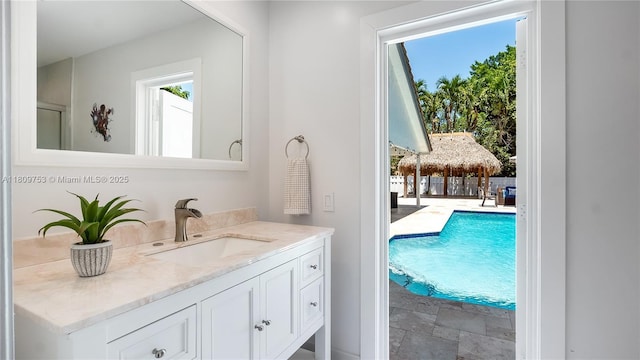 10412 NW 6th St, Coral Springs, FL 33071 - bathroom featuring vanity and stone finish flooring