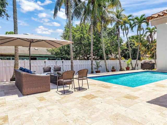 10412 NW 6th St, Coral Springs, FL 33071 - view of swimming pool with a patio, a fenced backyard, and an outdoor living space