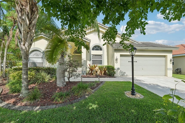 5708 NW 47th Ct, Coral Springs, FL 33067 - view of front of home with stucco siding, concrete driveway, a garage, and a front yard
