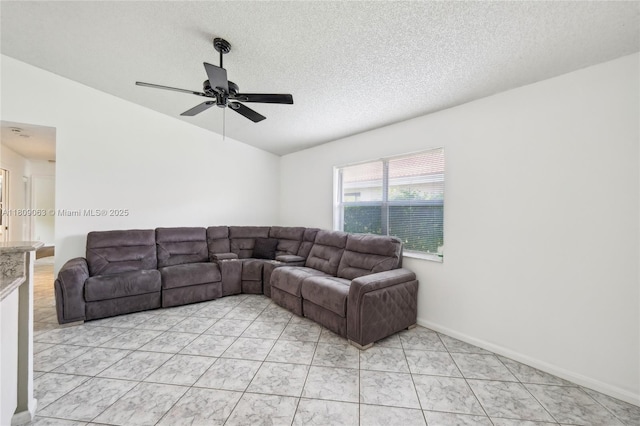 5708 NW 47th Ct, Coral Springs, FL 33067 - living area with ceiling fan, a textured ceiling, vaulted ceiling, and baseboards