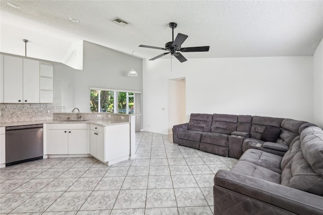 5708 NW 47th Ct, Coral Springs, FL 33067 - living room featuring a textured ceiling, a ceiling fan, and high vaulted ceiling