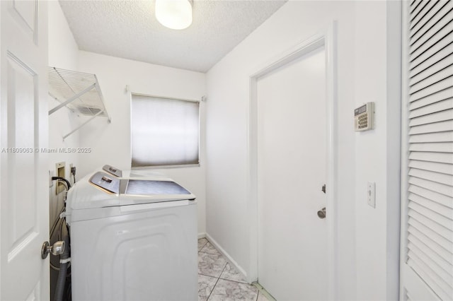 5708 NW 47th Ct, Coral Springs, FL 33067 - laundry area with washer / clothes dryer, light marble finish flooring, a textured ceiling, and baseboards