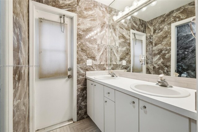 5708 NW 47th Ct, Coral Springs, FL 33067 - bathroom featuring double vanity and tile walls