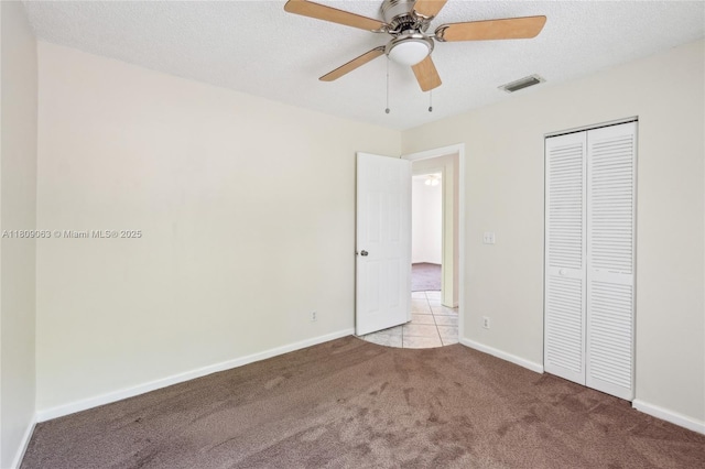 5708 NW 47th Ct, Coral Springs, FL 33067 - unfurnished bedroom featuring carpet, a closet, baseboards, ceiling fan, and a textured ceiling