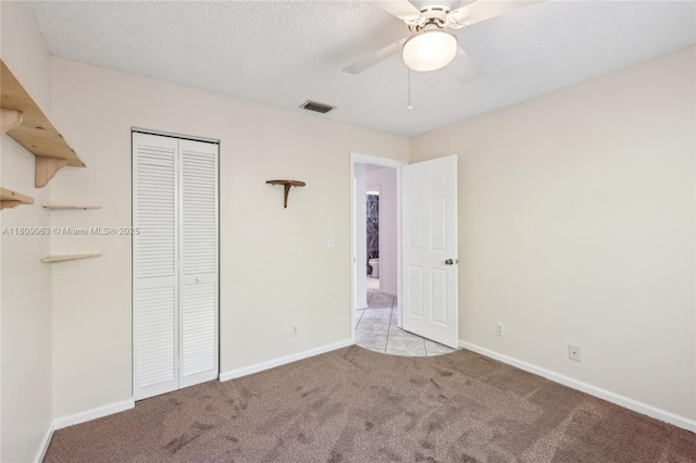 5708 NW 47th Ct, Coral Springs, FL 33067 - unfurnished bedroom with carpet floors, a closet, baseboards, a ceiling fan, and a textured ceiling