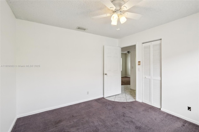 5708 NW 47th Ct, Coral Springs, FL 33067 - unfurnished bedroom with light carpet, a closet, baseboards, ceiling fan, and a textured ceiling