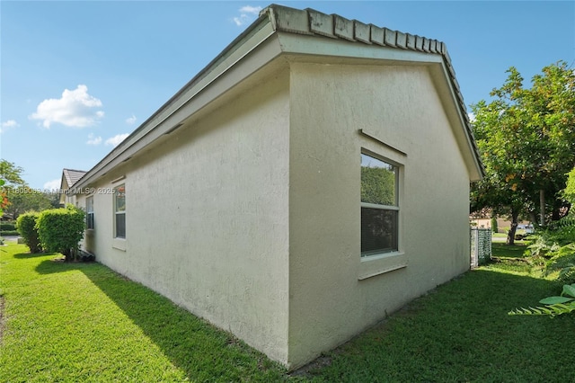 5708 NW 47th Ct, Coral Springs, FL 33067 - view of side of home featuring stucco siding and a yard