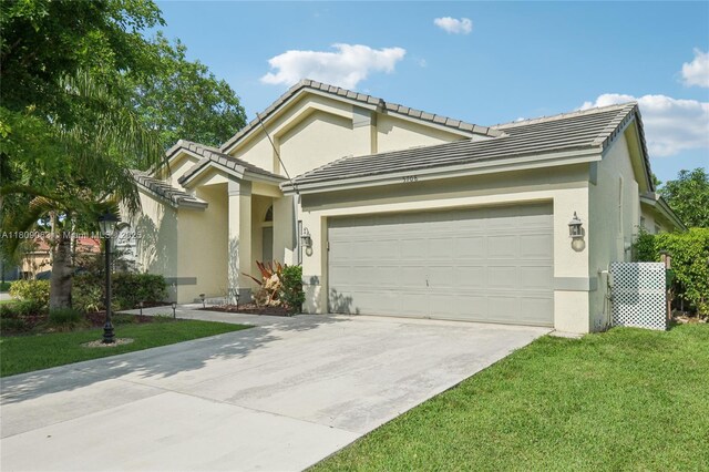 5708 NW 47th Ct, Coral Springs, FL 33067 - ranch-style house with concrete driveway, an attached garage, stucco siding, a front lawn, and a tiled roof