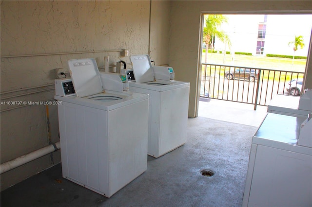 5100 SW 41st St Unit 214, Pembroke Park, FL 33023 - community laundry room featuring washing machine and clothes dryer and a textured wall