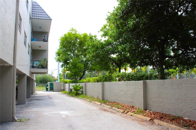 5100 SW 41st St Unit 214, Pembroke Park, FL 33023 - view of asphalt road featuring a gate