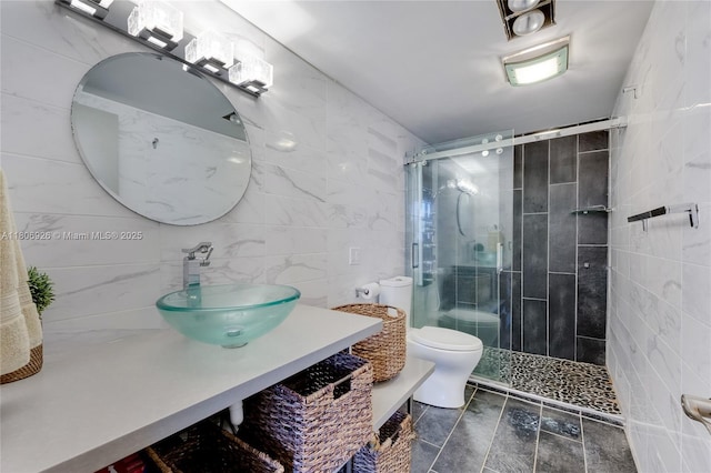 1601 S Ocean Dr Unit 106, Hollywood, FL 33019 - full bath with tile walls, a shower stall, toilet, and vanity