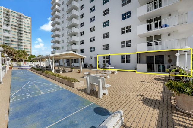 1601 S Ocean Dr Unit 106, Hollywood, FL 33019 - view of property's community with shuffleboard and uncovered parking