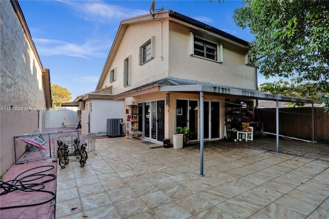 520 SW 90th Ct, Miami, FL 33174 - back of property featuring stucco siding, a patio, and central air condition unit
