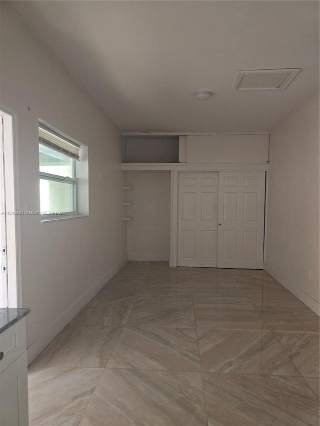 520 SW 90th Ct, Miami, FL 33174 - unfurnished bedroom with attic access, a closet, and baseboards