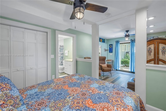 515 Gulf Blvd, Indian Rocks Beach, FL 33785 - bedroom with ceiling fan, connected bathroom, and wood finished floors