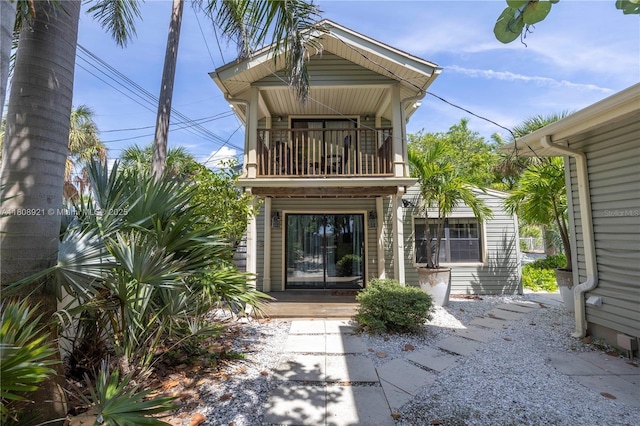 515 Gulf Blvd, Indian Rocks Beach, FL 33785 - back of house featuring a balcony