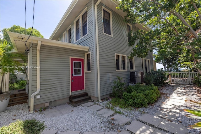 515 Gulf Blvd, Indian Rocks Beach, FL 33785 - view of side of home with entry steps and central AC