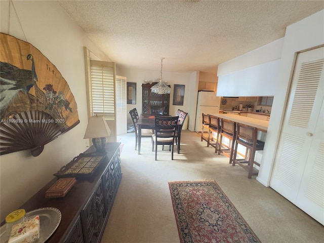 12951 SW 95th Ave, Miami, FL 33176 - dining area featuring a textured ceiling and a chandelier