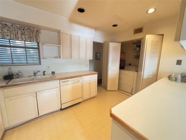 12951 SW 95th Ave, Miami, FL 33176 - kitchen with white dishwasher, a sink, separate washer and dryer, light floors, and light countertops