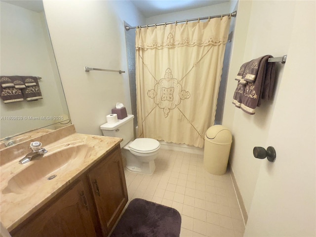 12951 SW 95th Ave, Miami, FL 33176 - full bath with toilet, vanity, tile patterned flooring, and baseboards