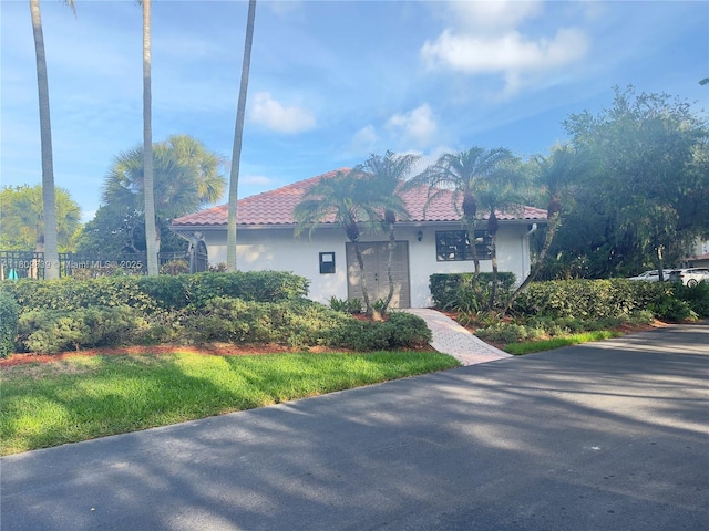 12951 SW 95th Ave, Miami, FL 33176 - view of property exterior featuring stucco siding and a tile roof