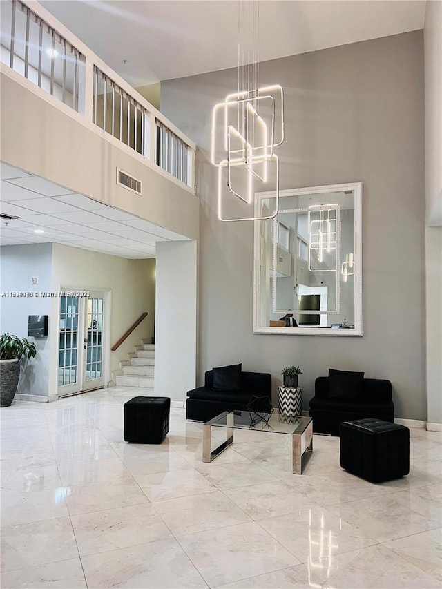 2780 NE 183rd St Unit 1110, Aventura, FL 33160 - common area with a towering ceiling and stairs