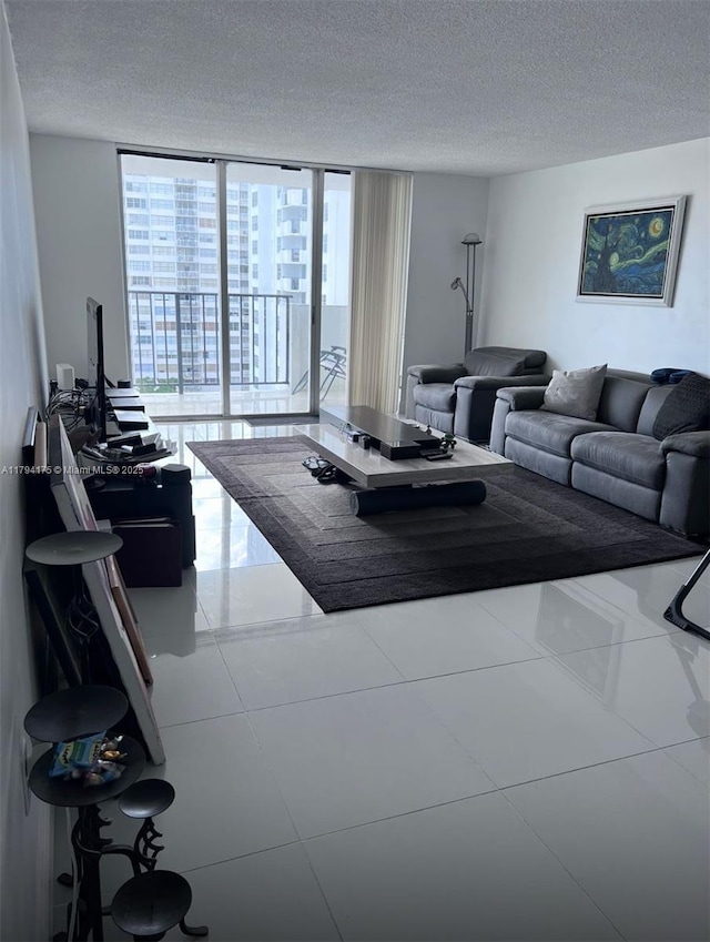 2780 NE 183rd St Unit 1110, Aventura, FL 33160 - tiled living area featuring floor to ceiling windows and a textured ceiling