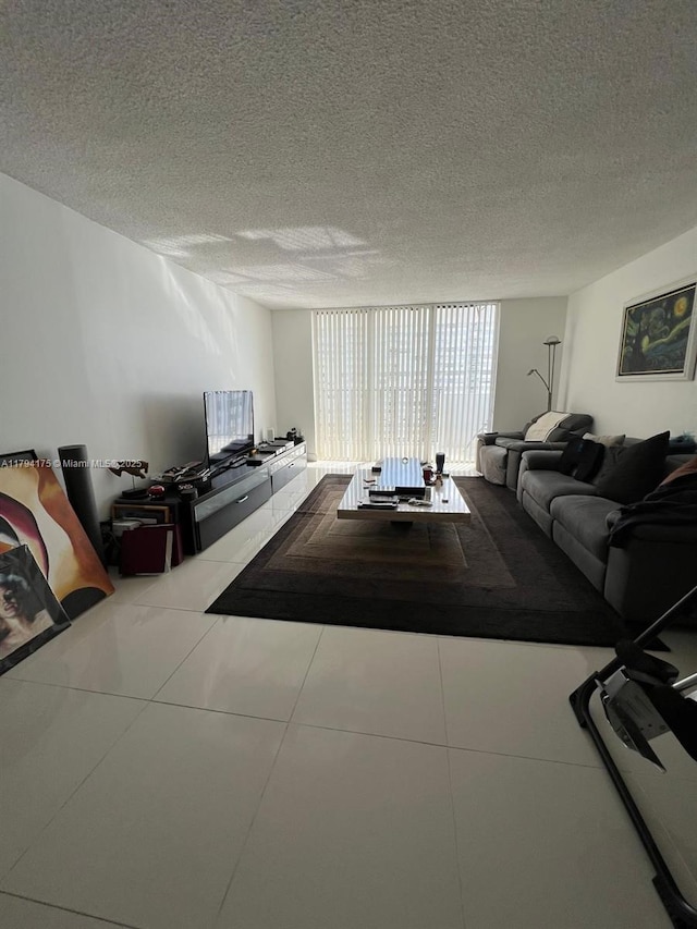 2780 NE 183rd St Unit 1110, Aventura, FL 33160 - tiled living room featuring a textured ceiling