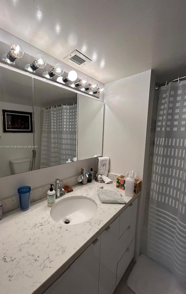 2780 NE 183rd St Unit 1110, Aventura, FL 33160 - full bathroom featuring vanity, toilet, and a shower with curtain