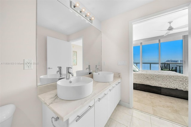 888 Biscayne Blvd Unit 3702, Miami, FL 33132 - ensuite bathroom featuring double vanity, ceiling fan, toilet, tile patterned flooring, and a water view