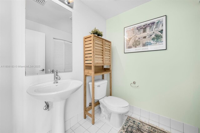 888 Biscayne Blvd Unit 3702, Miami, FL 33132 - bathroom featuring toilet, tile patterned flooring, and baseboards