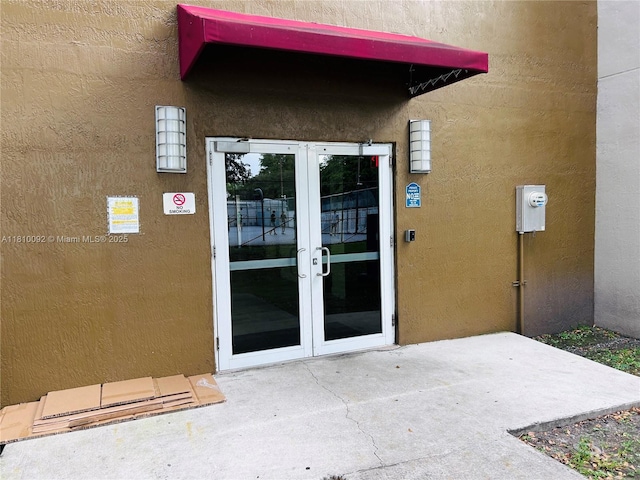 11040 SW 196th St Unit 209, Cutler Bay, FL 33157 - property entrance featuring french doors, stucco siding, and a patio area