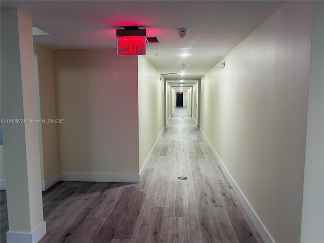 11040 SW 196th St Unit 209, Cutler Bay, FL 33157 - hallway featuring wood finished floors and baseboards