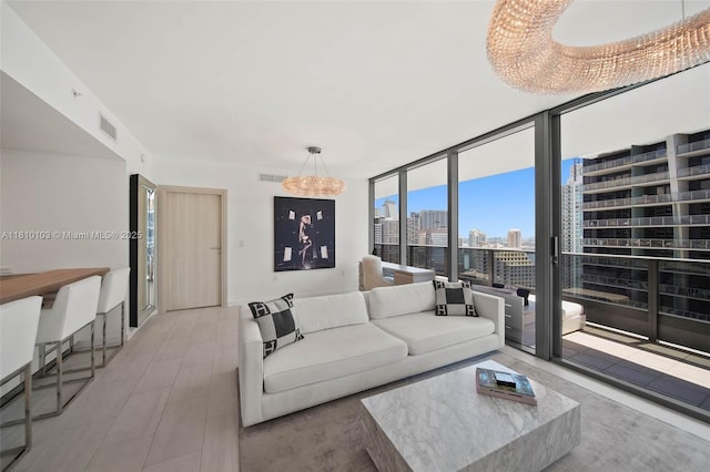 1000 Brickell Plz Unit 4209, Miami, FL 33131 - living area featuring a skyline view, a wall of windows, and a chandelier