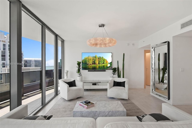 1000 Brickell Plz Unit 4209, Miami, FL 33131 - living area with wood finished floors, a chandelier, baseboards, and floor to ceiling windows